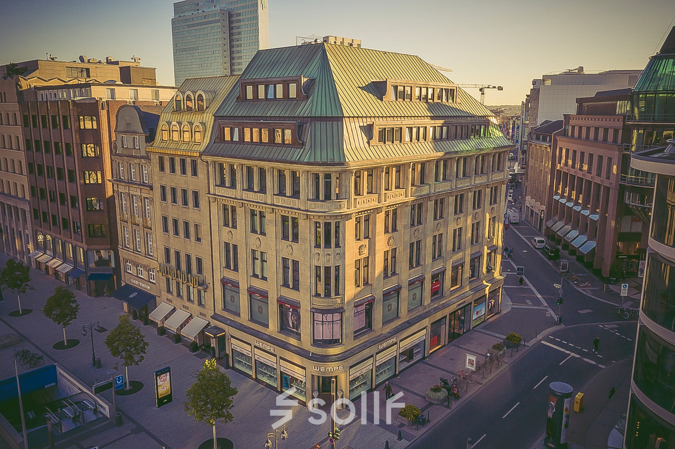 Aerial view of an office building located at Königsallee 14, Düsseldorf Old Town, with shops on the ground level. Ideal for office space rental.