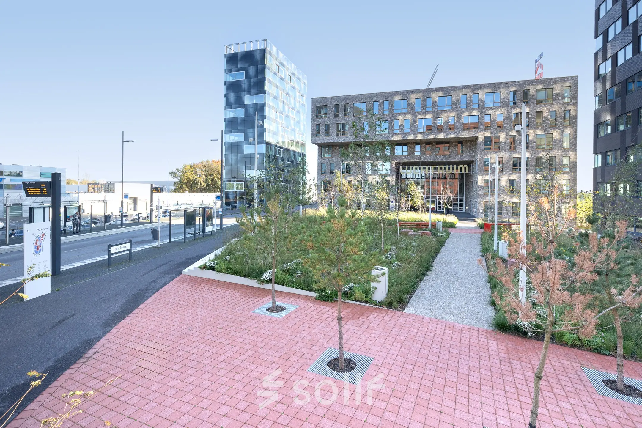 Exterior view of office buildings at Flight Forum 120-159, Eindhoven Airport, featuring modern design and landscaped surroundings ideal for office space rental.