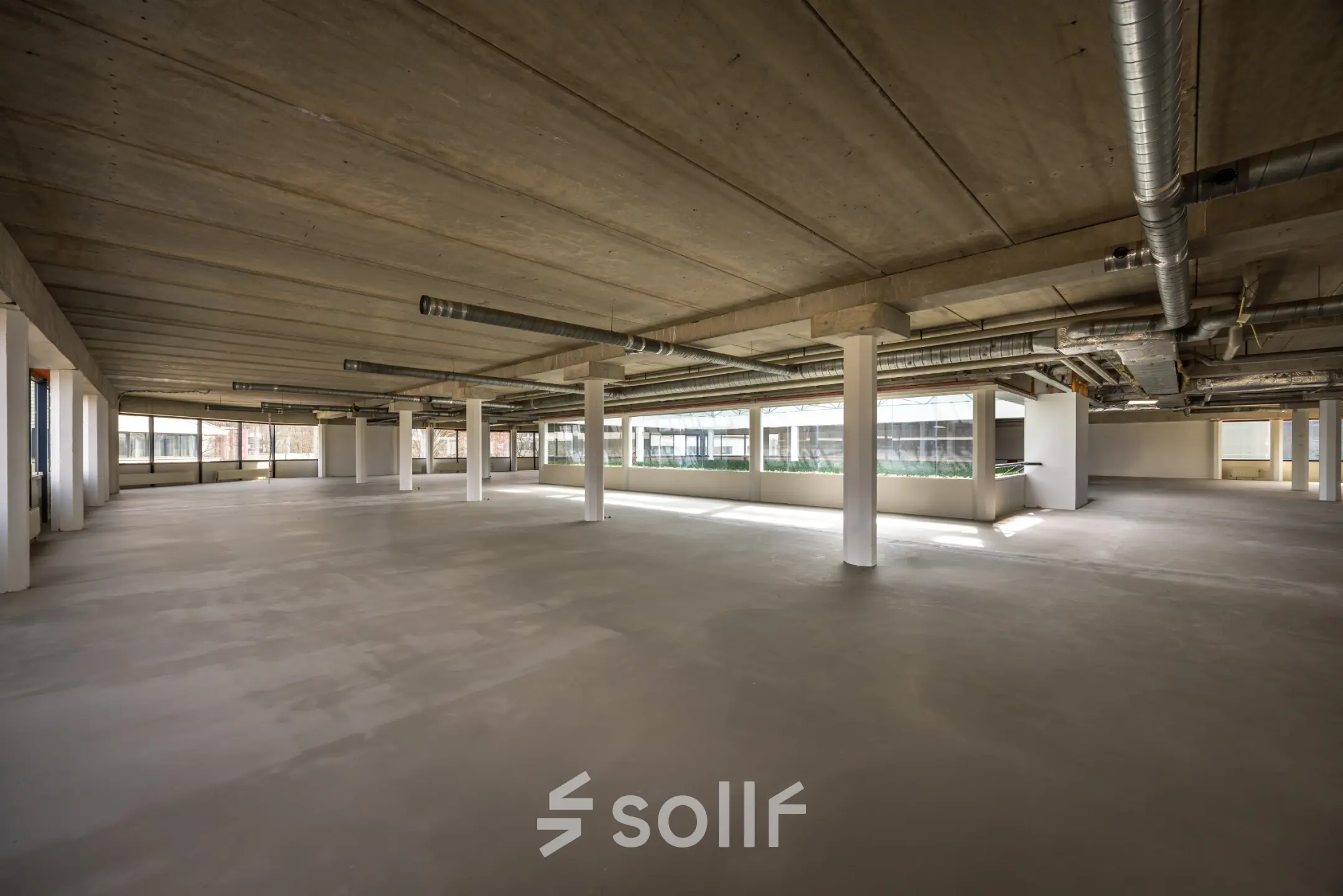 Spacious, unfurnished interior at Luchthavenweg 81, ideal for office space rental.