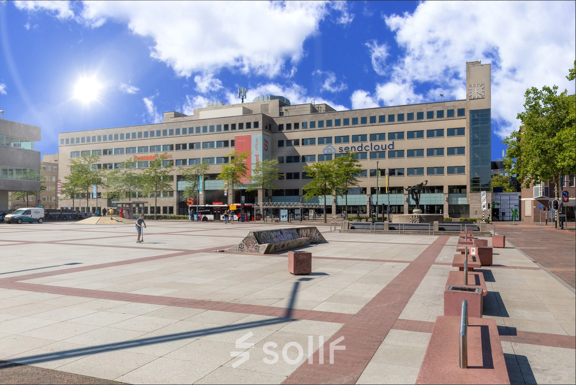 Exterior view of the office building at Stadhuisplein 10, Eindhoven Center, suitable for office space rental. The plaza is open and spacious with a modern building backdrop.