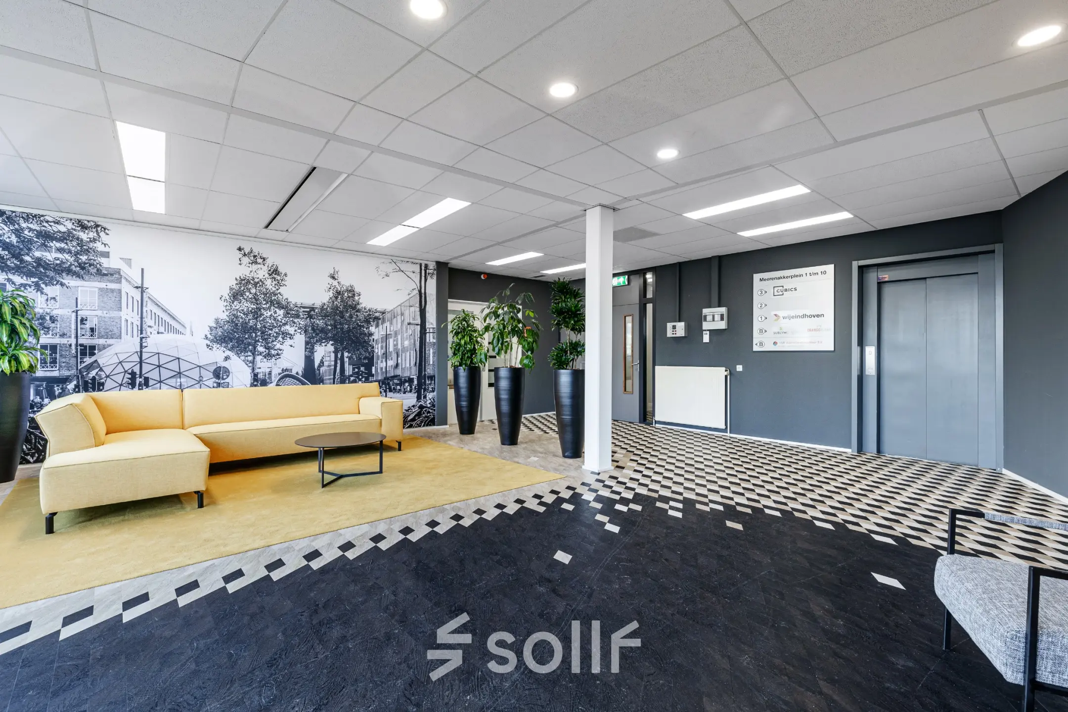 Spacious office lounge with modern decor at Meerenakkerplein 1-10, ideal for those seeking office space rental in Eindhoven De Hurk.