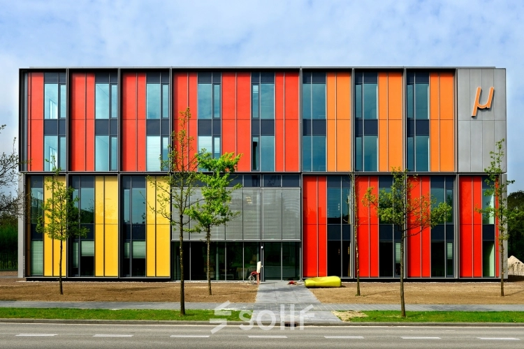 Colorful exterior of the office building at High Tech Campus 10, Eindhoven, with vibrant panels and modern architecture, ideal for advanced companies seeking office space rental in a high-tech environment.