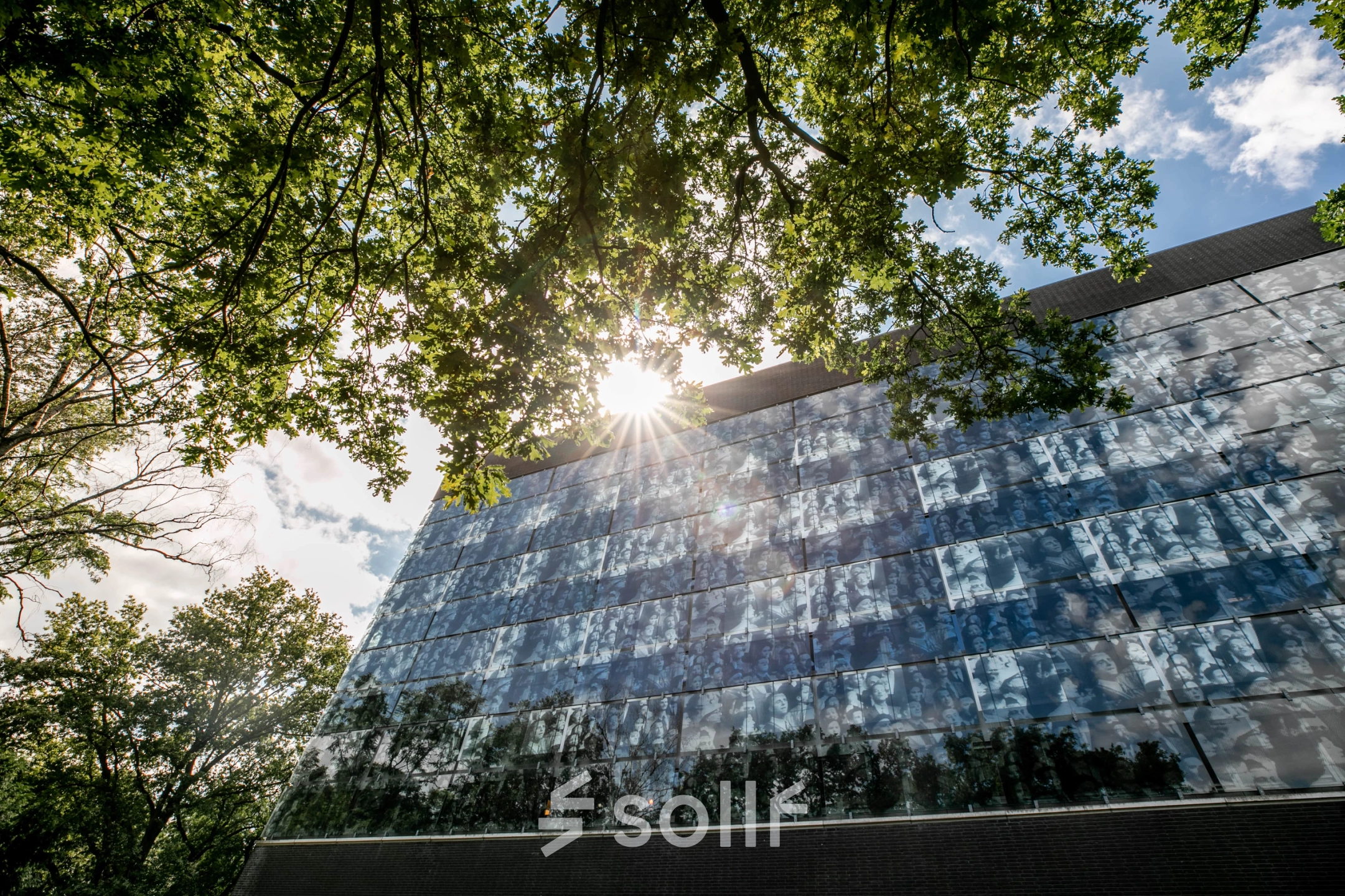 Exterior view of office building at TU campus, De Zaale 11, Eindhoven High Tech Campus, surrounded by trees under a sunny sky. Ideal for those seeking office space rental.