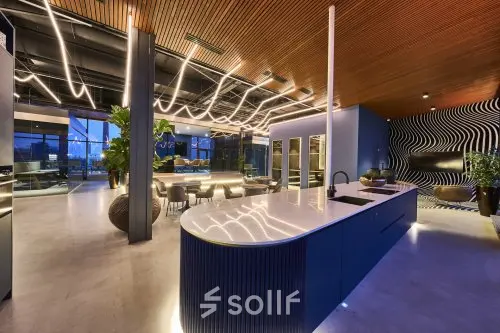 Modern office interior at Achtseweg Zuid 159R, Eindhoven Strijp-S, featuring stylish lighting and seating, perfect for office space rental.