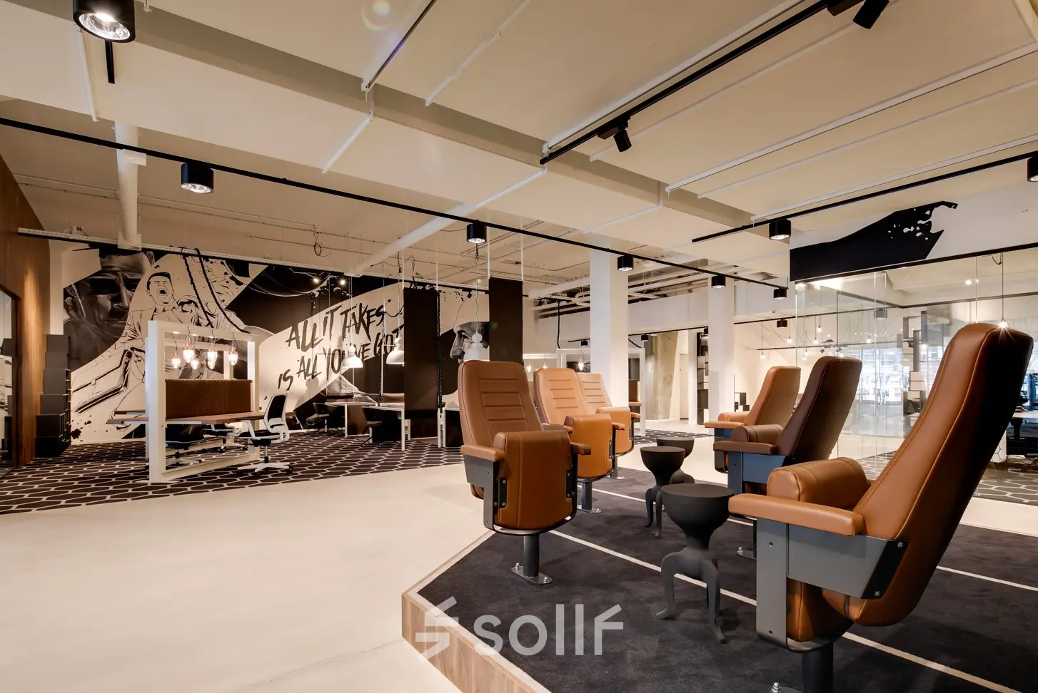 Furnished office to rent in Eindhoven Strijp-S at Frederiklaan 10E, featuring modern workspaces with unique seating and artistic decor.