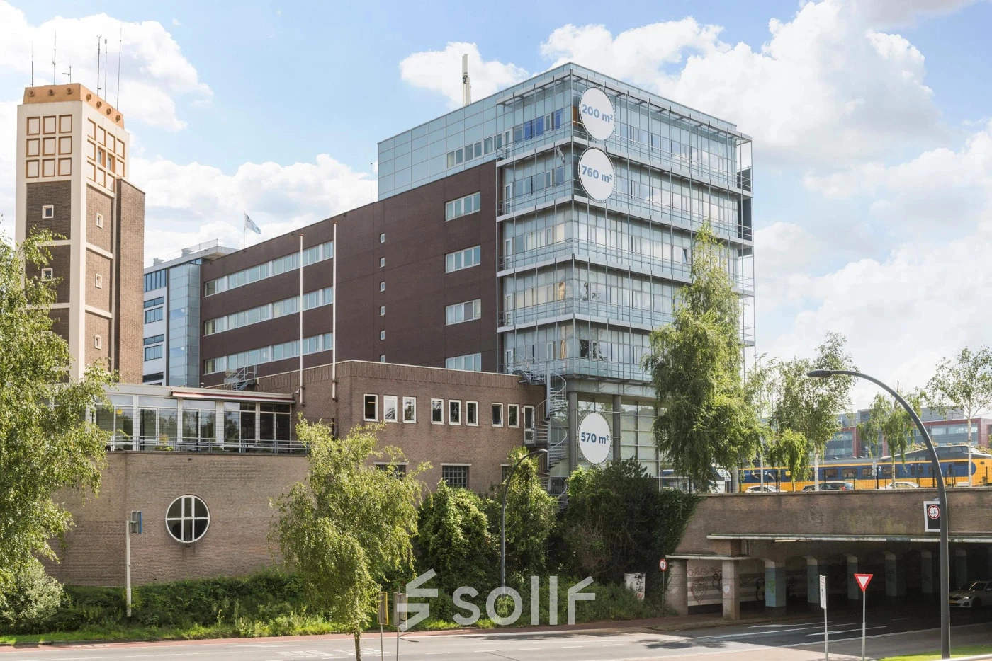 Exterior view of a multi-story office building at Brandweerstraat 20-30 in Enschede, featuring a modern design and ample windows. Ideal for those seeking office space rental with a convenient location.