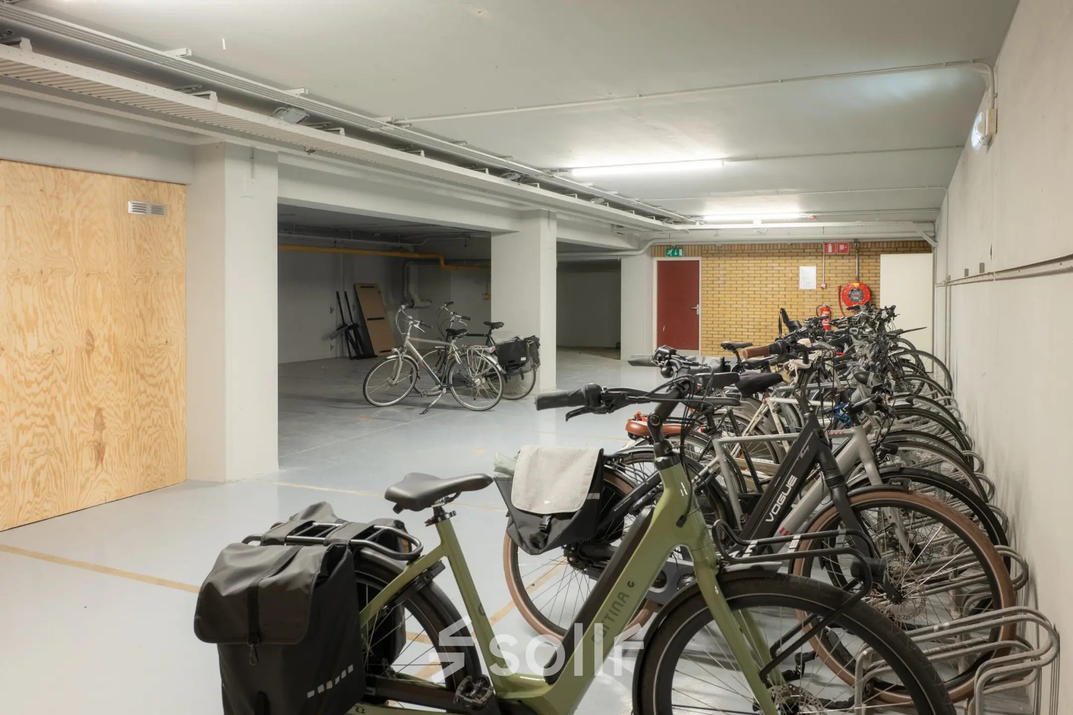 Spacious bicycle parking area at Kuipersdijk 2-4, Enschede, part of an office space rental opportunity.
