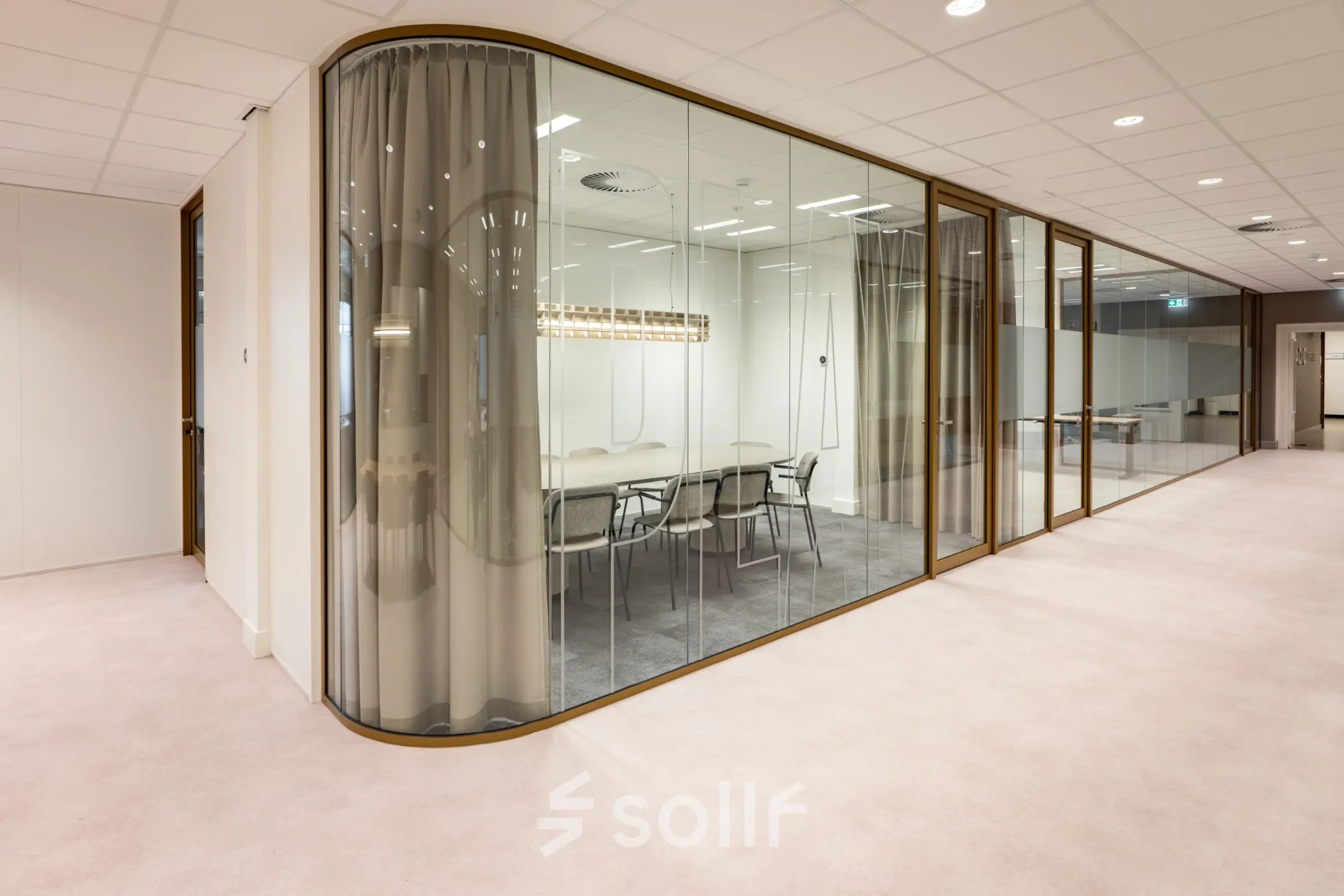 Modern office space rental at Kuipersdijk 2-4, Enschede, featuring a glass-walled conference room with a table and chairs.