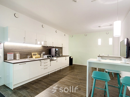 Bright office pantry at Mergenthaler Allee 15-21, Eschborn, ready for rent. Ideal for office space rental, featuring modern kitchen amenities and seating area.