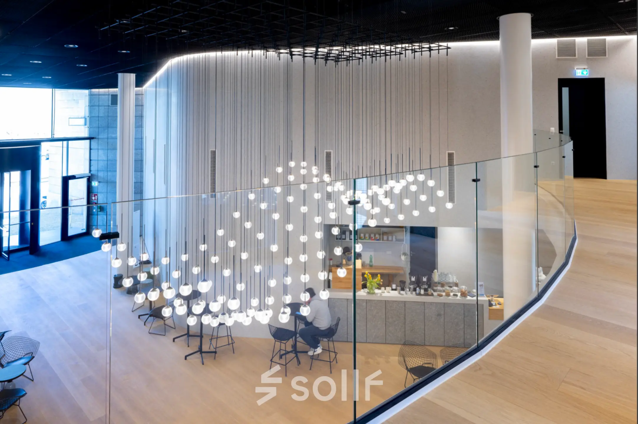 Modern office reception area with stylish lighting at Solmsstrasse 83, Frankfurt Bockenheim, ideal for office space rental.