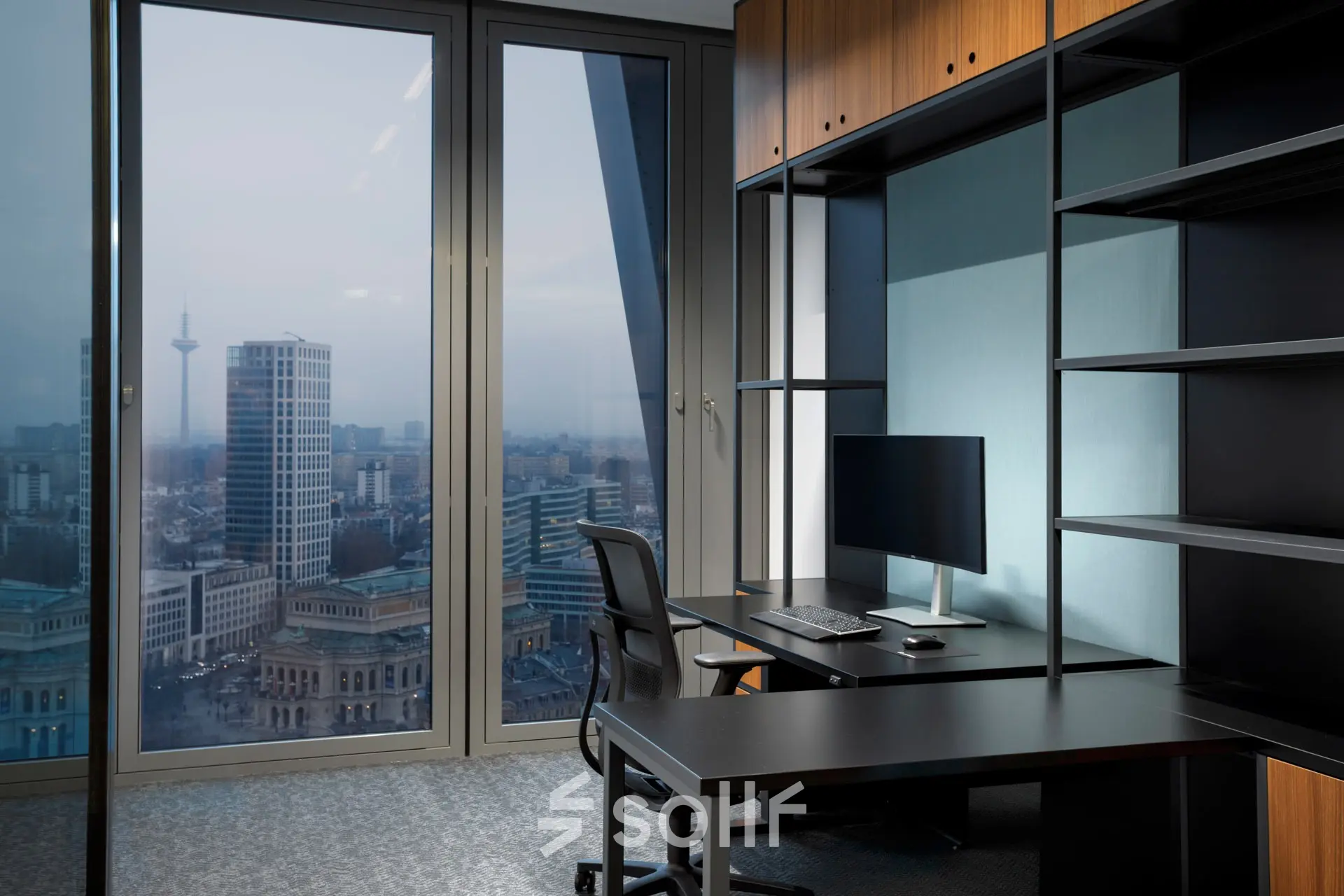 Modern office space rental at Junghofstraße 9, Frankfurt Center with large windows offering city views. Ideal office to rent with a sleek desk and chair setup.