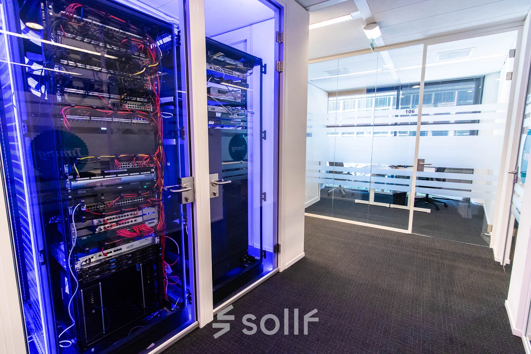 Modern office space with a server room and a glass-walled meeting area at Kampenringweg 45, Gouda, available for rent. Office space rental features a high-tech setup.