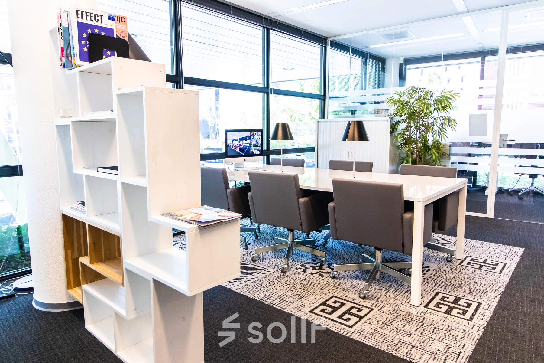 Furnished office space with a meeting table and chairs at Kampenringweg 45, Gouda, ideal for office space rental.