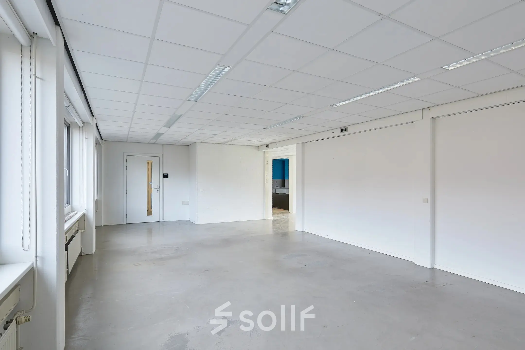 Spacious and bright office space for rent at Schweitzerlaan 12, Groningen, featuring plain walls and ceiling lights, ideal for customization.