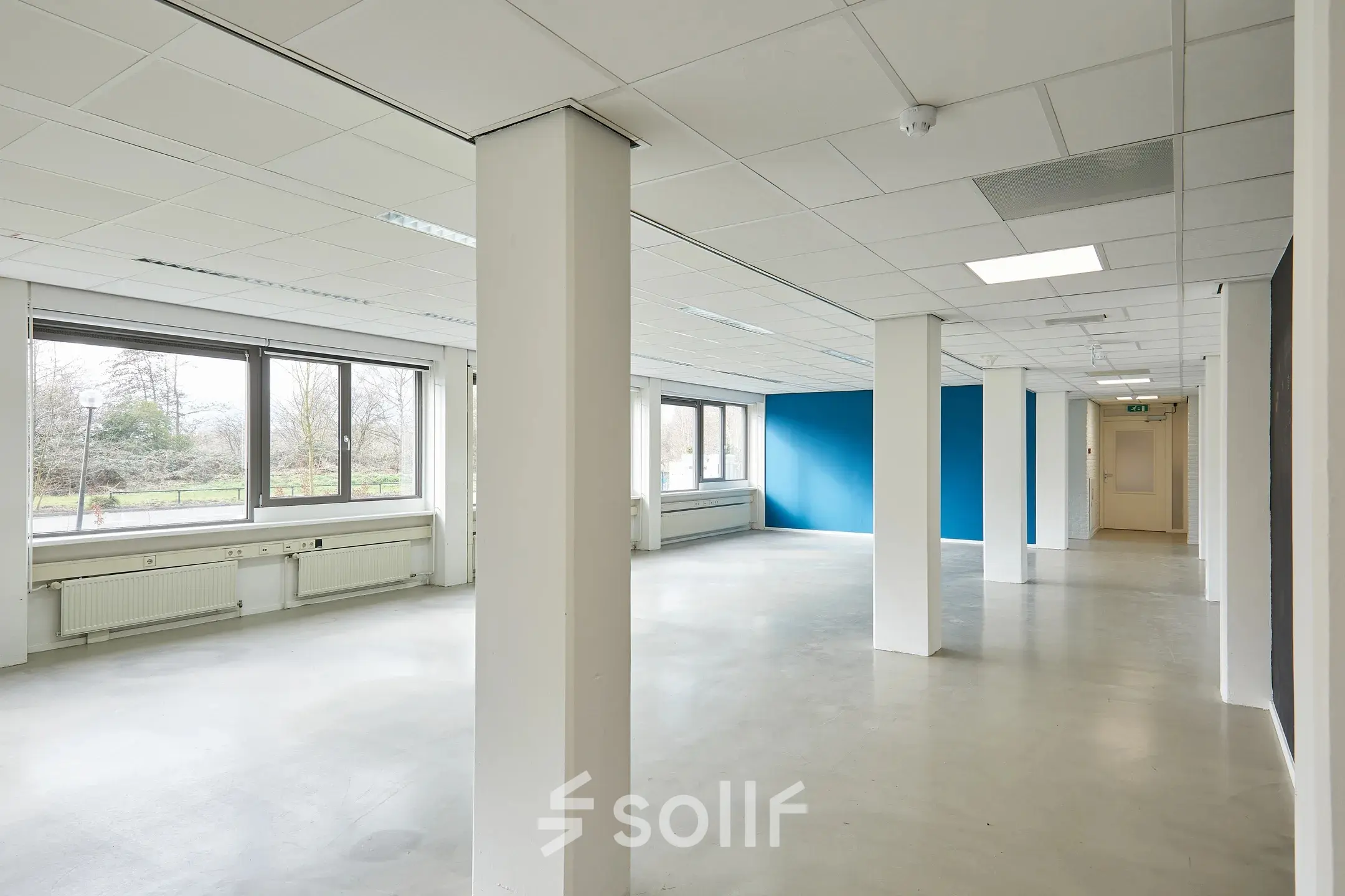Spacious office to rent in Groningen at Schweitzerlaan 12, featuring large windows and an open layout perfect for customizable office space rental.