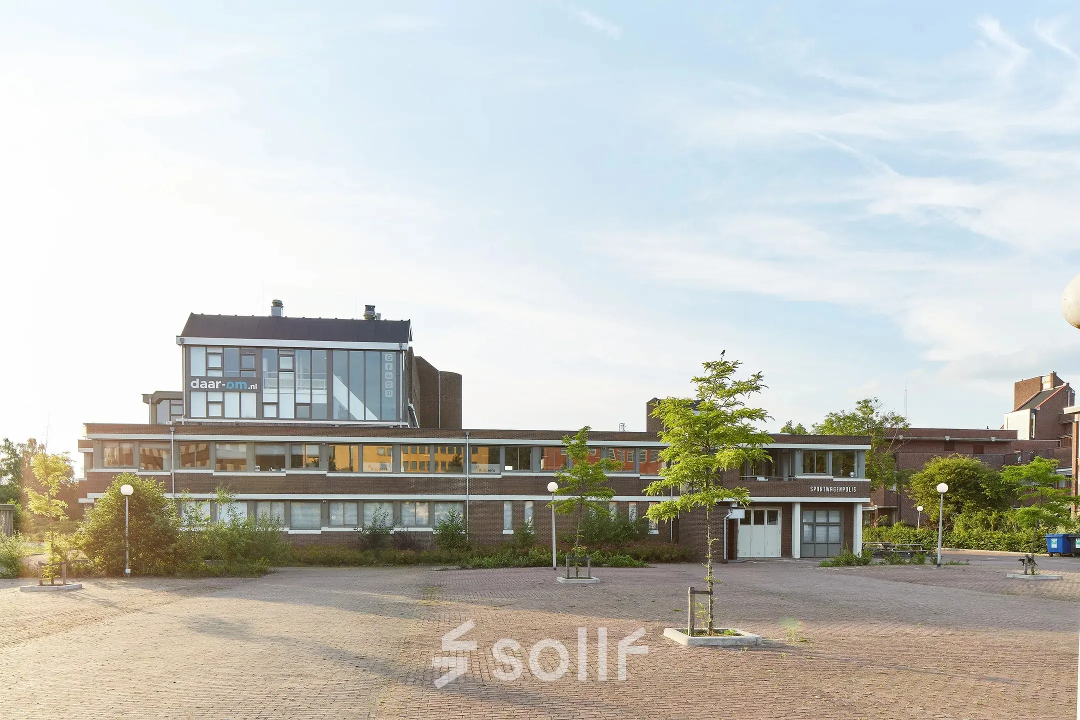 Exterior view of the office building at Schweitzerlaan 12, Groningen, featuring a modern design ideal for office space rental.
