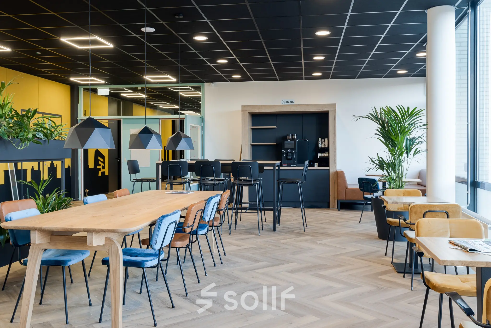 Modern office space at Zernikepark 12, Groningen, featuring stylish seating and a coffee station, ideal for office space rental.
