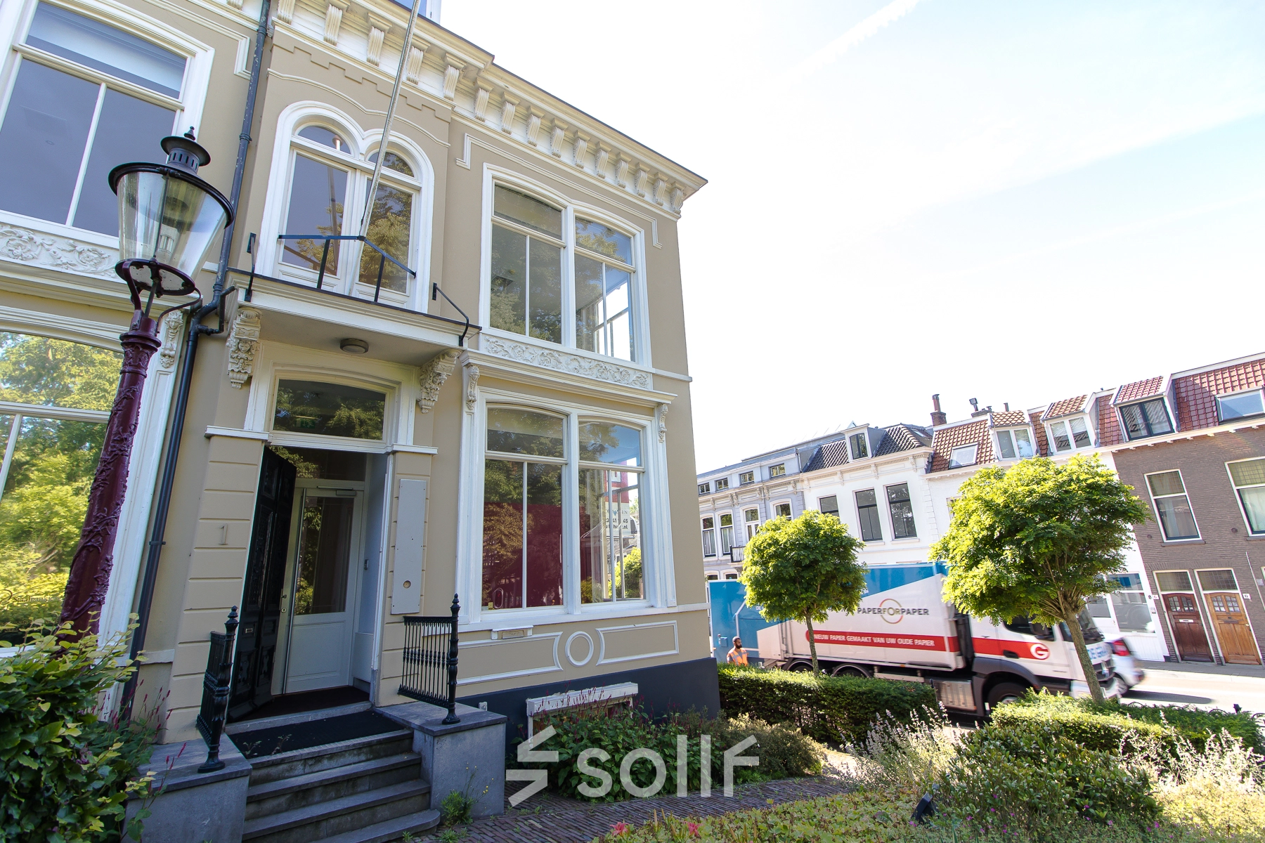 Exterior view of an office building at Prinsen Bolwerk 1, Haarlem Centraal Station with large windows and classic architecture.