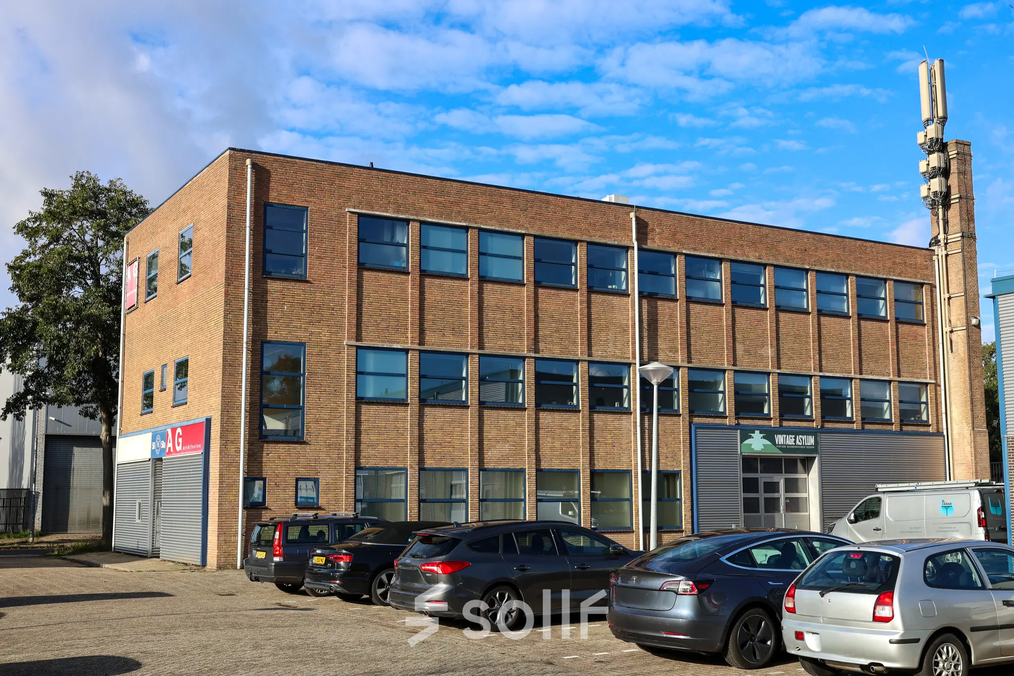 Exterior view of an office building located at Nijverheidsweg 50 in Haarlem Oost, showcasing a potential office space rental.
