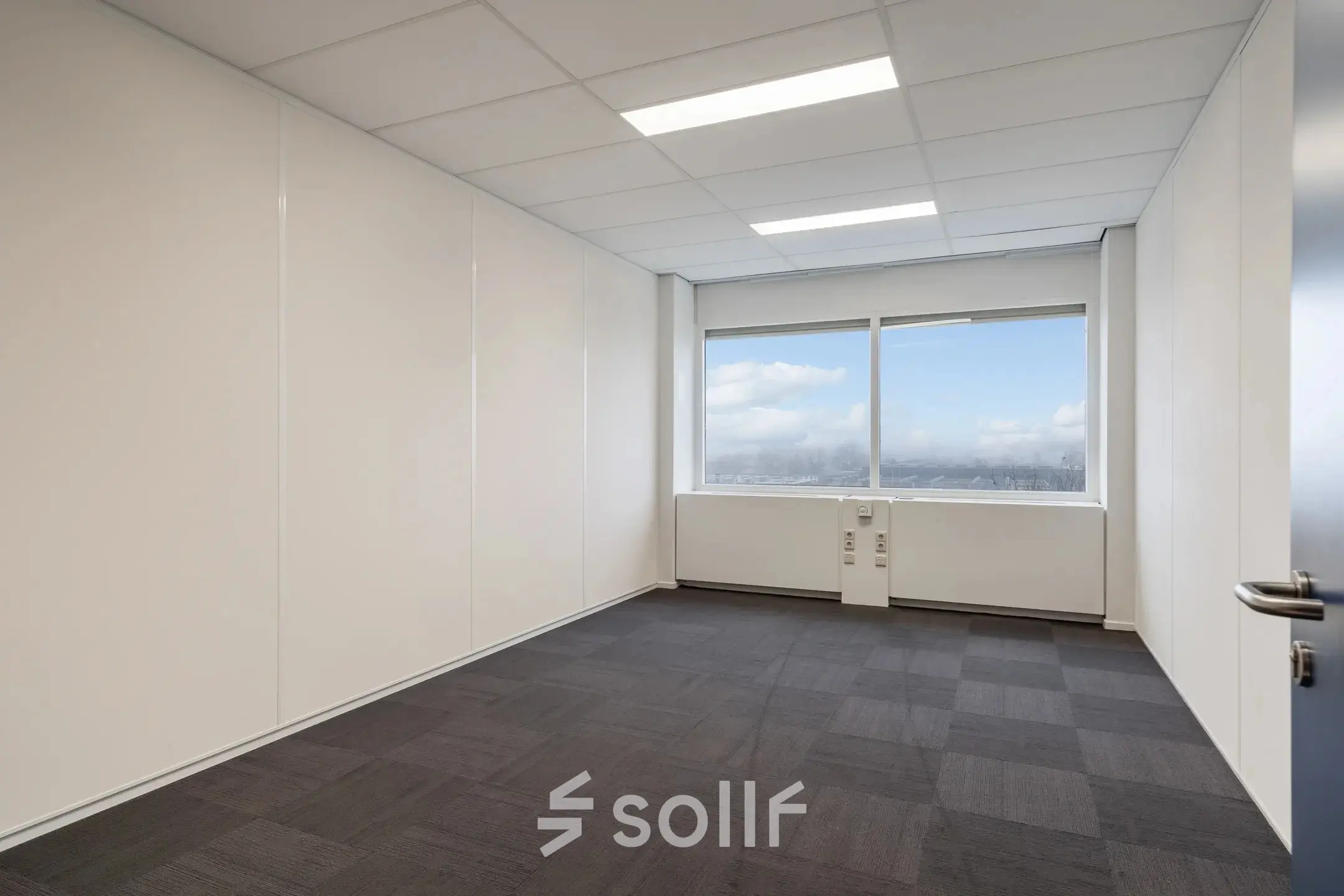 Empty office space with large windows at A. Hofmanweg 5A in Haarlem Waarderpolder, available for rent. Ideal for customizing your workspace.