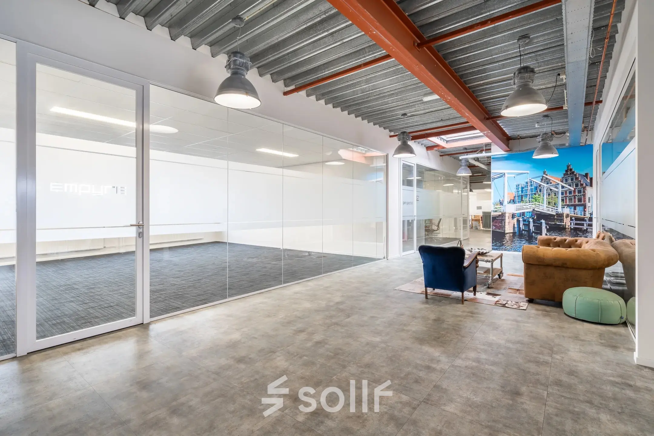 Spacious open floorplan available for office space rental at Bingerweg 18A - 18R in Haarlem Waarderpolder. Features large windows and modern seating, ideal for a comfortable work environment.