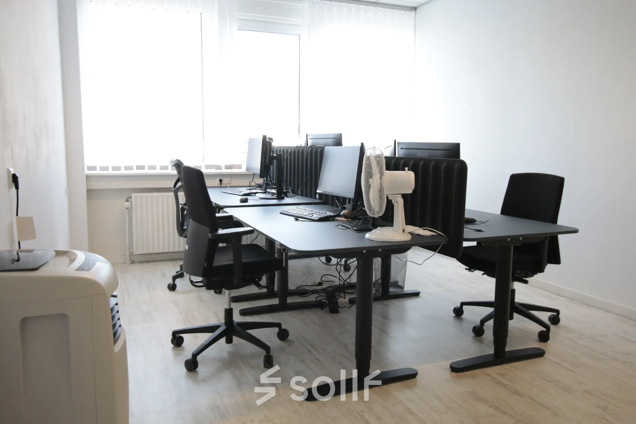 Bright, furnished office space at Waarderweg 19, Haarlem Waarderpolder, featuring desks, chairs, and computers with ample natural light. Ideal for office space rental.