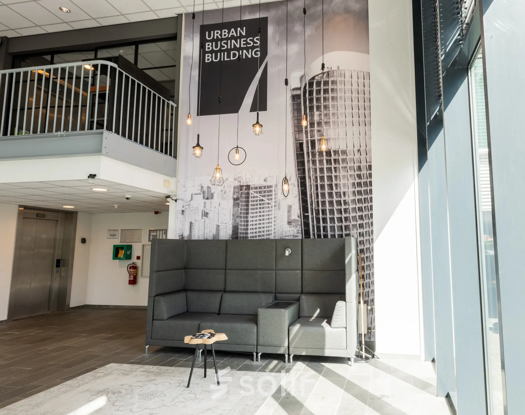 Spacious office entrance with modern seating area for rent at Demmersweg 3 in Hengelo, ideal for making a great first impression in your new office space rental.