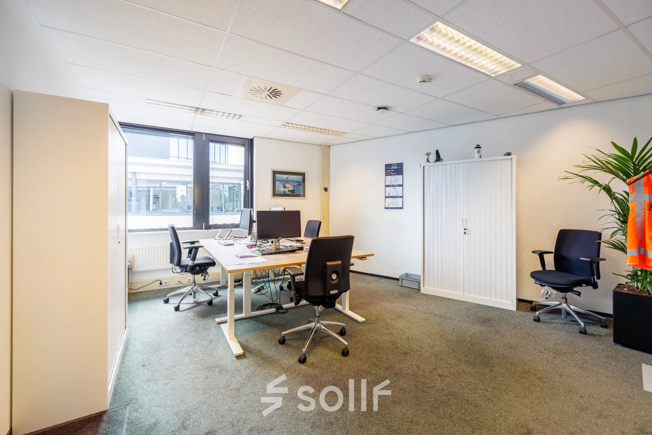 Furnished office space at Welbergweg 60 in Hengelo, featuring desks and chairs, ideal for rent office space needs.