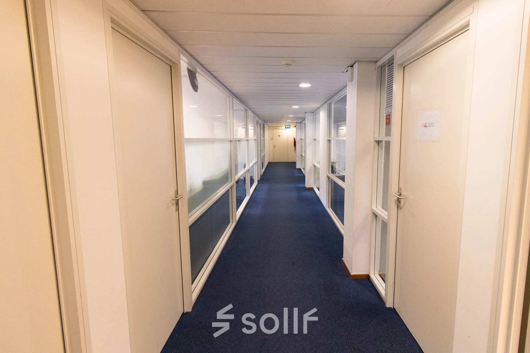 Bright hallway in an office building at Franciscusweg 219, Hilversum, showcasing potential for office space rental.