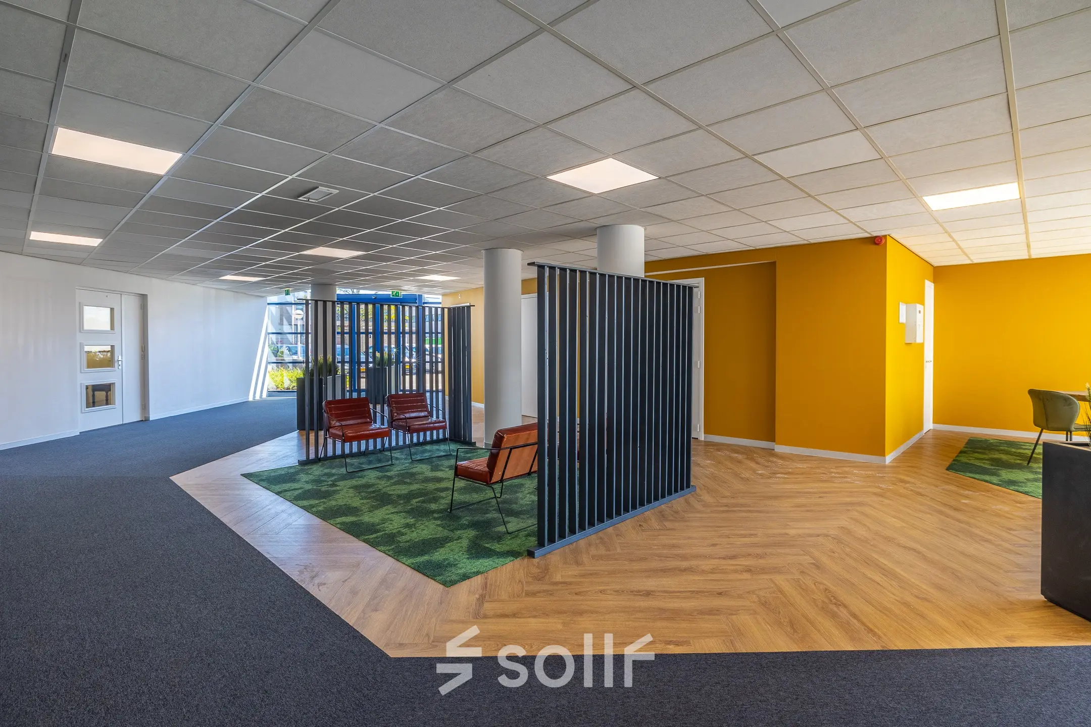 Spacious office to rent at Franciscusweg 219 in Hilversum, featuring a modern layout with semi-private workspaces and bright colors.