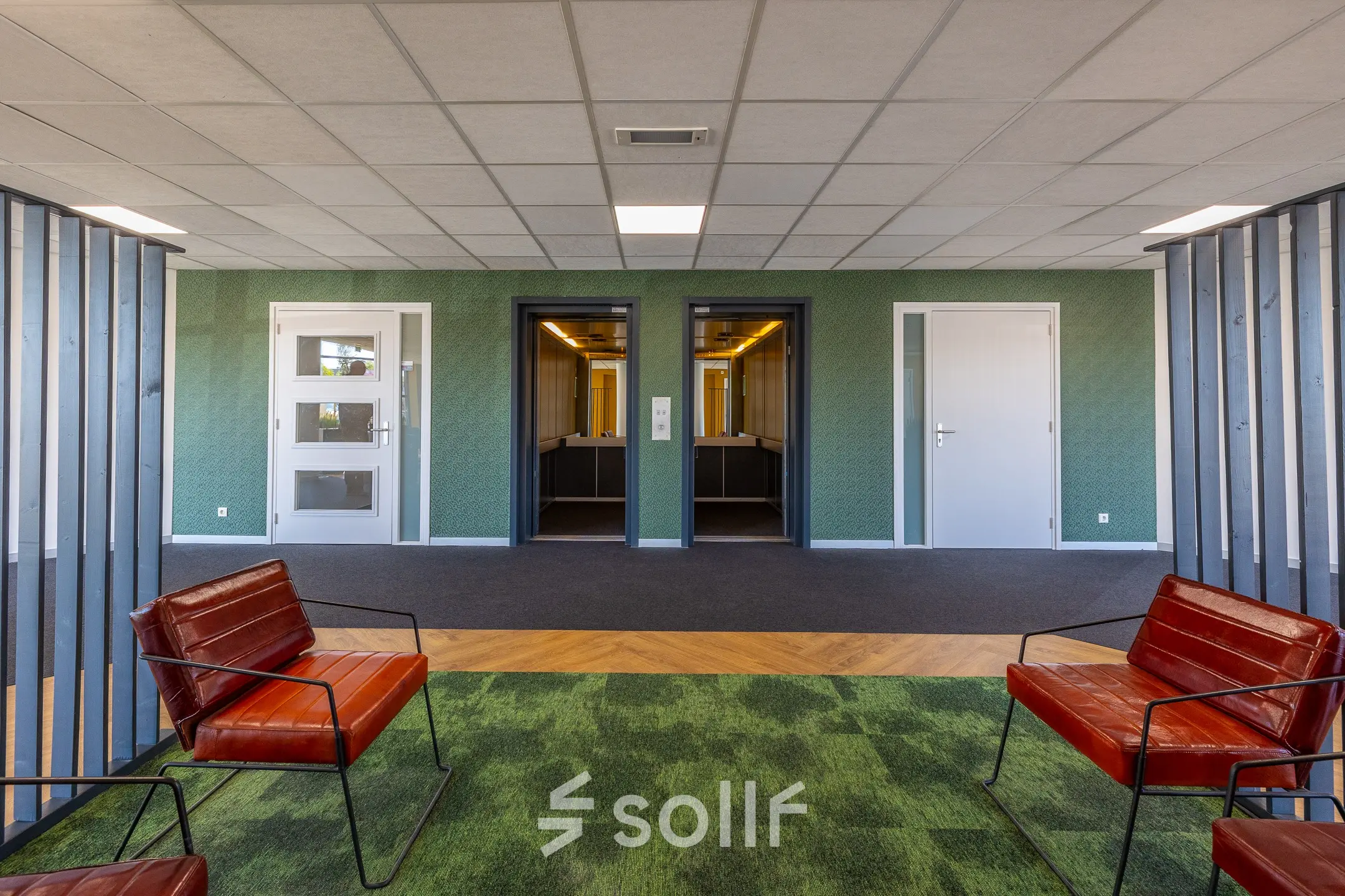 Modern office space at Franciscusweg 219, Hilversum, featuring comfortable seating and elevator access for office space rental.