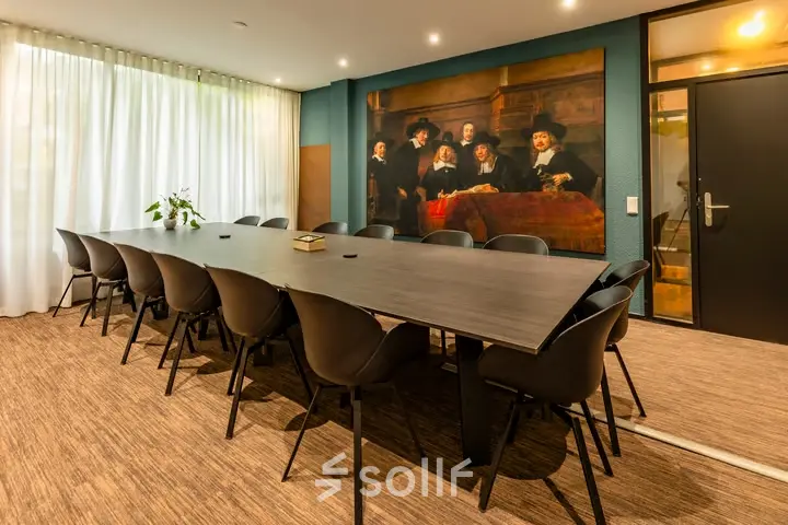 Conference room at Steijnlaan 16, Hilversum, ideal for office space rental with a long table and chairs, offering a professional setting for meetings.