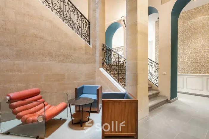 Stylish office entrance at Siriusdreef 17, Hoofddorp featuring modern seating and elegant stairway. Ideal for office space rental.