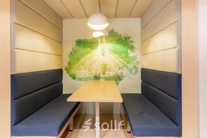 Cozy furnished workspace at Siriusdreef 17 in Hoofddorp available for rent office space with seating booths and unique wall design.
