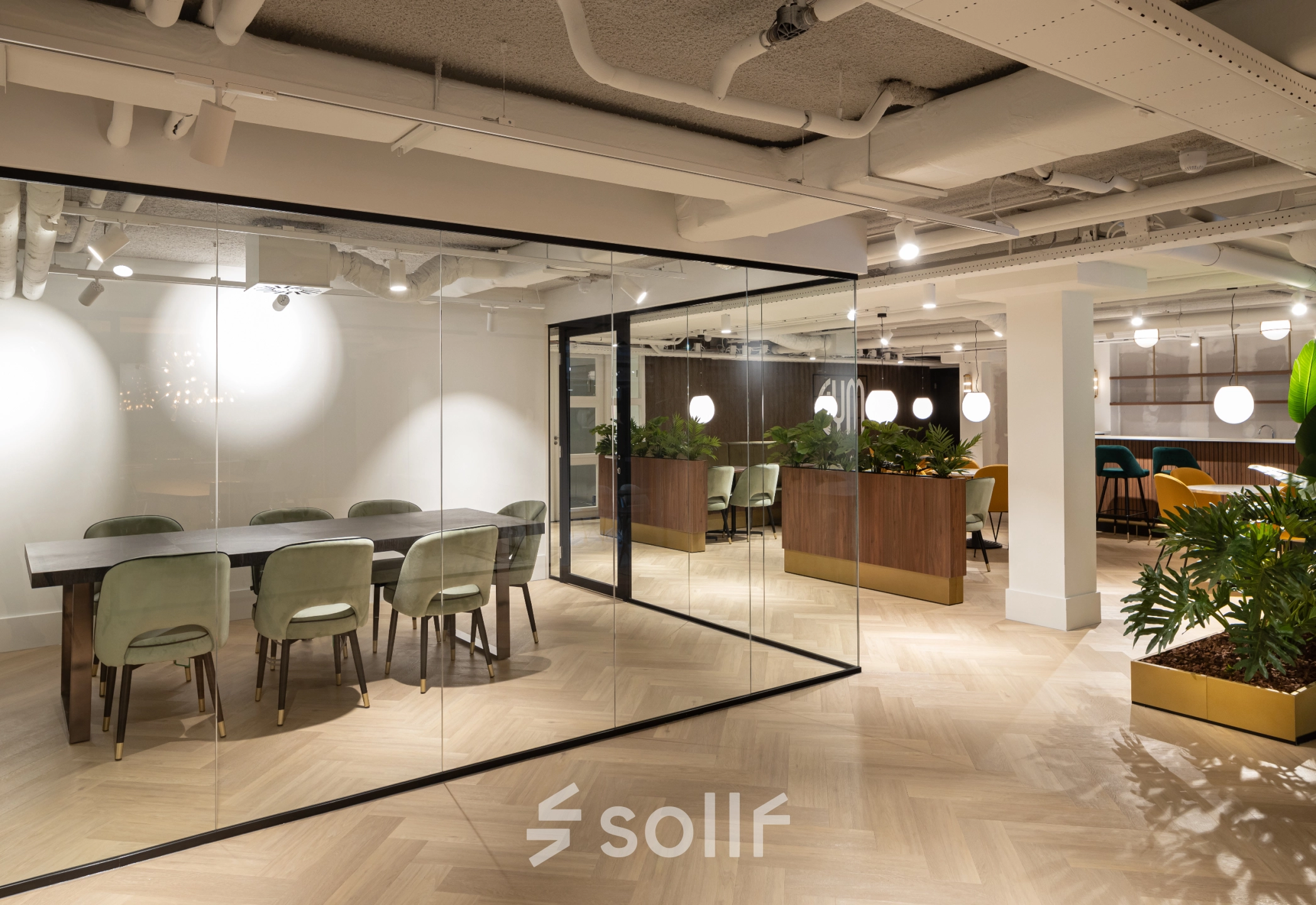 Modern office space with glass-walled conference room and stylish wooden dividers, offering a versatile workspace in Siriusdreef 60, Hoofddorp. Ideal for businesses looking for an office space rental with an elegant touch.