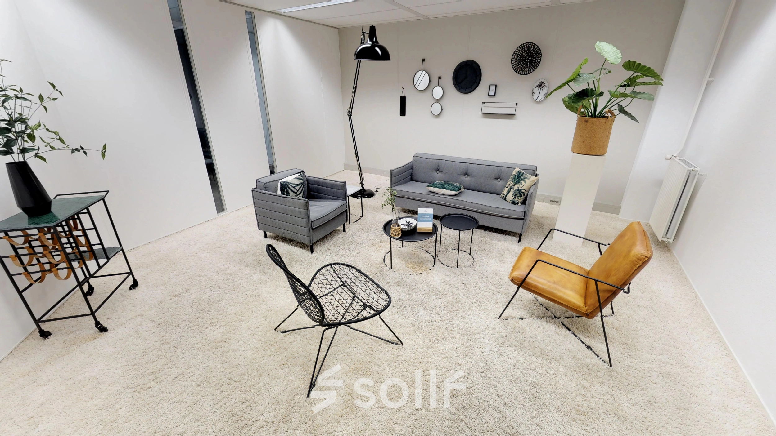 Stylish office space rental in Houten featuring cozy seating, modern decor, and a welcome area ideal for meetings or relaxation.