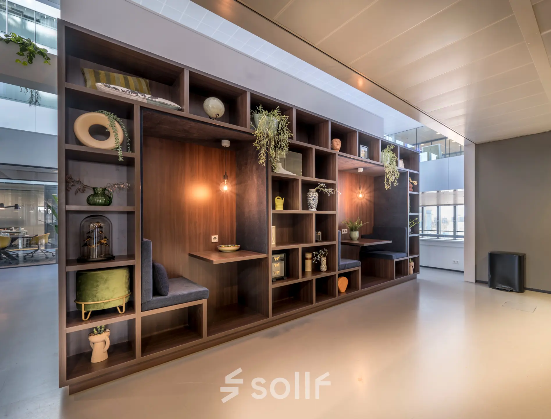 Stylish office space for rent at Bargelaan 200, Leiden, featuring a modern interior with furnished workspaces and natural decor elements.