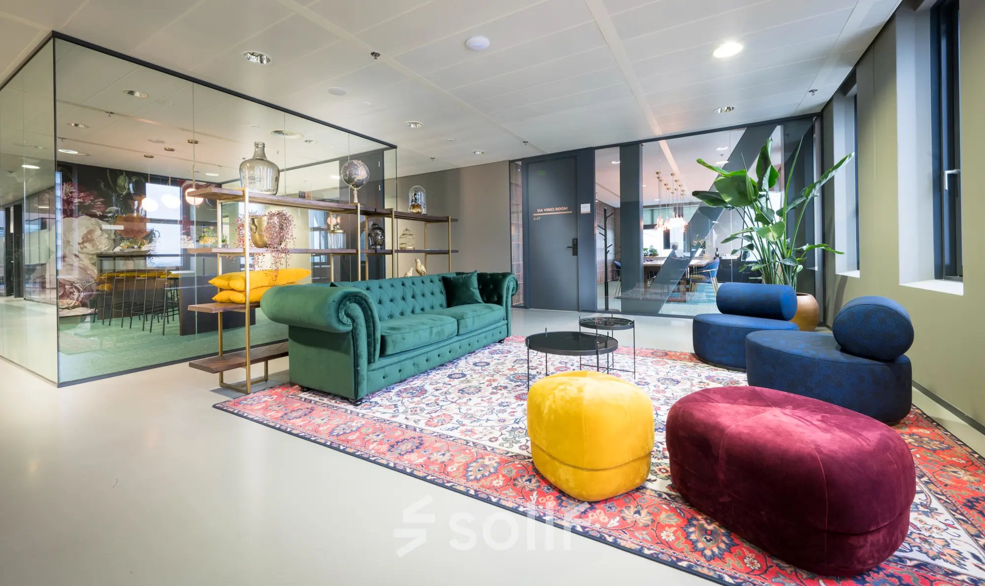Stylish and colorful furnished lounge area available for office space rental at Bargelaan 200, Leiden.