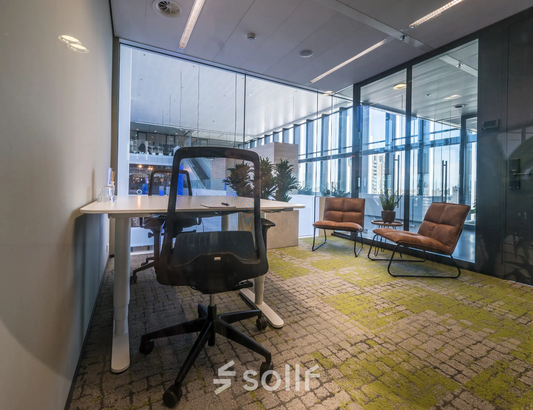 Office space for rent at Bargelaan 200, Leiden, featuring modern furnishings and ample natural light, ideal for professional work activities.