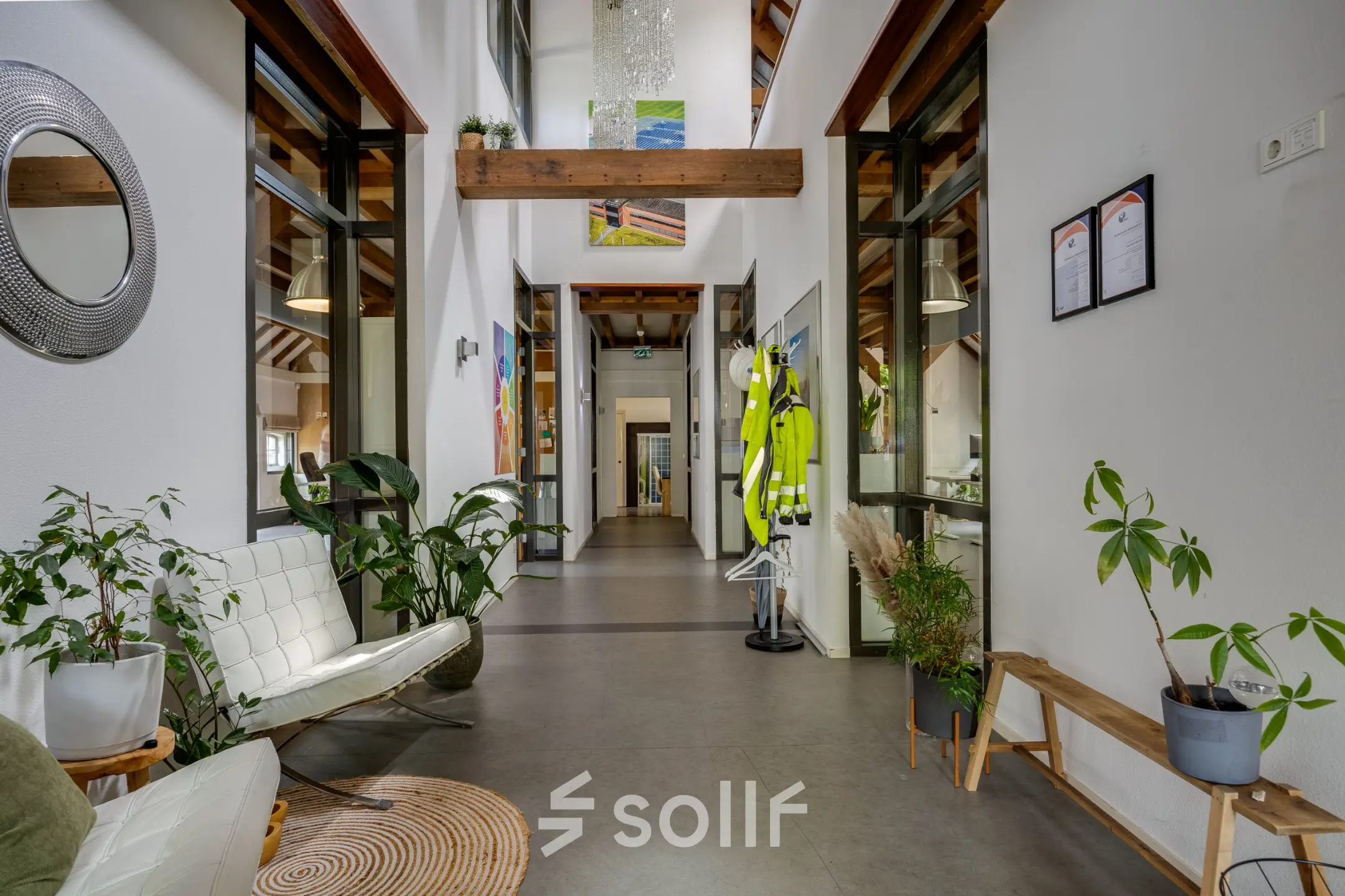 View of a bright, furnished office interior at Hamersveldseweg 120, Leusden, available for rent. The space features seating, plants, and décor, ideal for office space rental seekers.