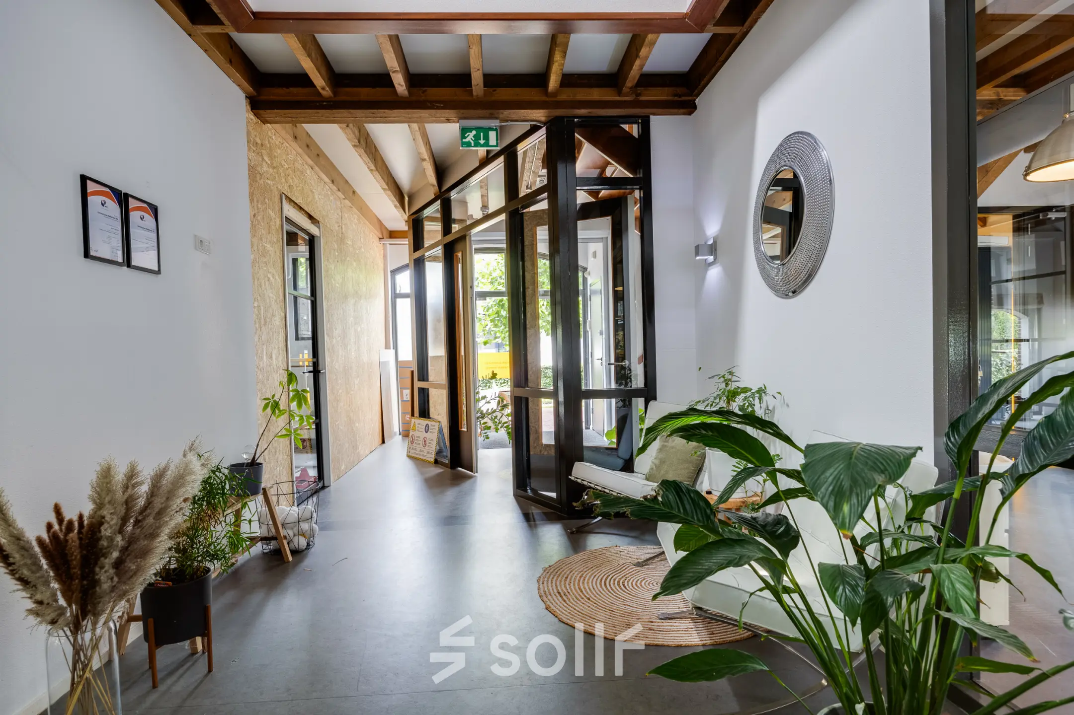 Bright office interior at Hamersveldseweg 120, Leusden, featuring modern decor with plants and stylish furnishings, perfect for office space rental opportunities.