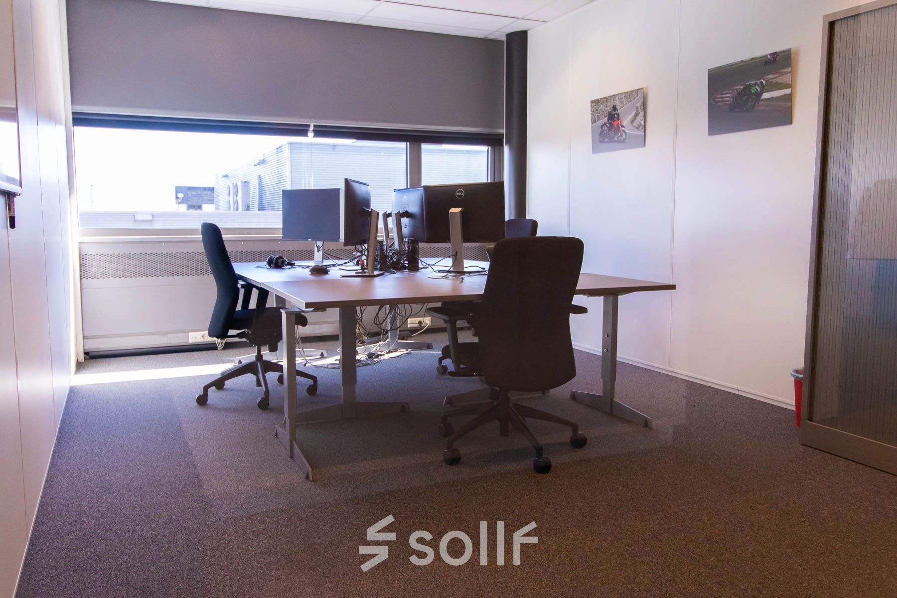 Bright office space with desks and chairs, available for rent at Brieltjenspolder 28, in Made. Ideal for office space rental needs with a cozy setup.
