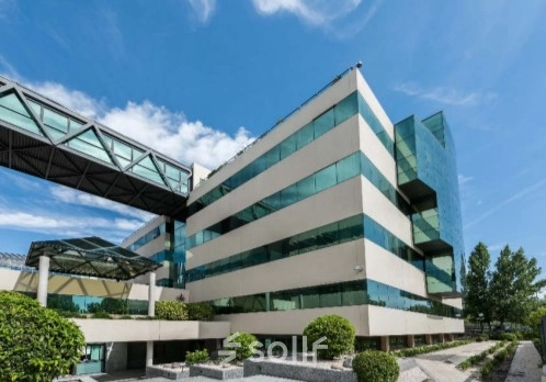 Exterior view of a modern office building at Calle de Francisca Delgado 9 in Madrid Alcobendas, ideal for office space rental with its sleek design.