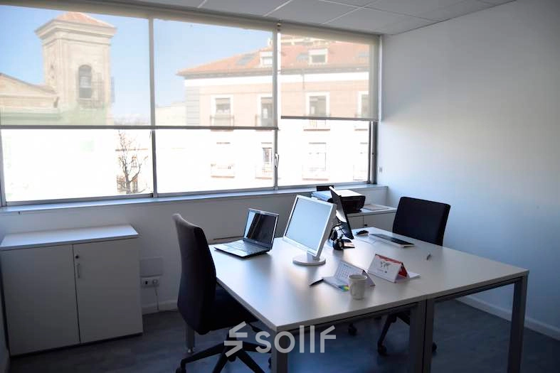 Well-lit office space with large windows offering city views at Plaza Santa María Soledad Torres Acosta 1, Madrid Center. Perfect for those seeking office space rental.