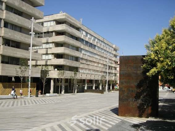 Exterior view of office building at Plaza Santa María Soledad Torres Acosta 1, Madrid Center showcasing modern architecture and spacious surroundings.