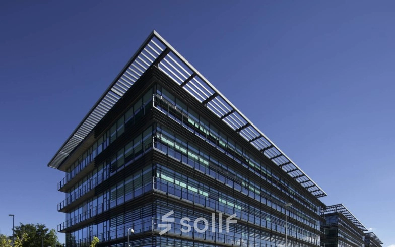 Modern office building exterior at Calle Quintanavides 13, Madrid Fuencarral-El Pardo, ideal for office space rental with sleek architectural design.