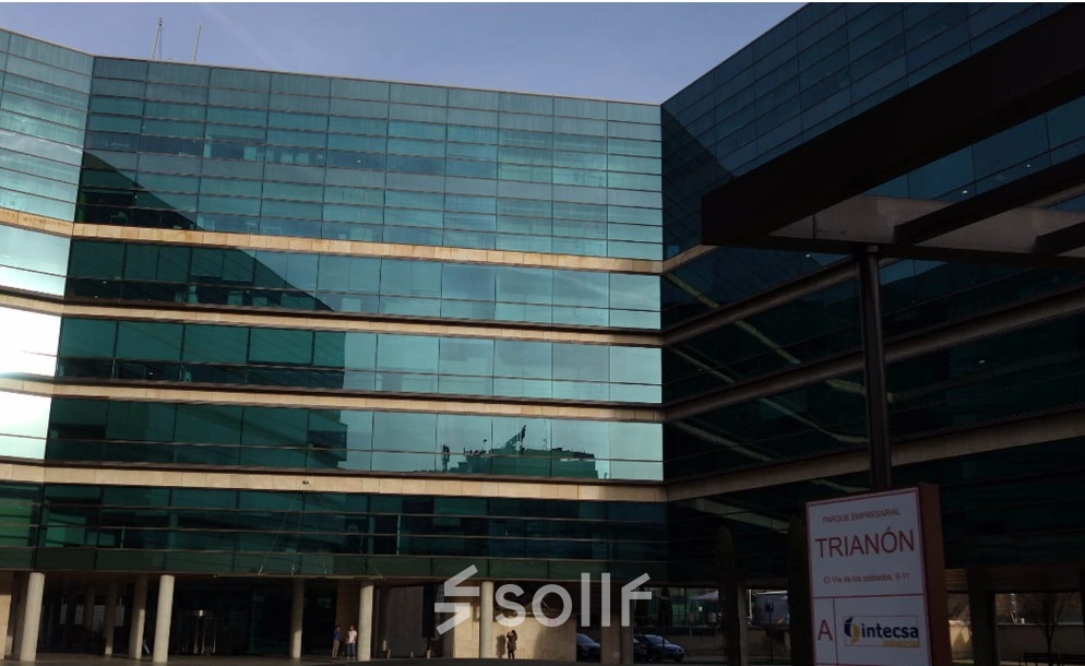 Glass-facade building located at Calle Vía de los Poblados 1 in Madrid Hortaleza, ideal for office space rental. Exterior view showcasing modern architecture suitable for businesses looking to rent office space.