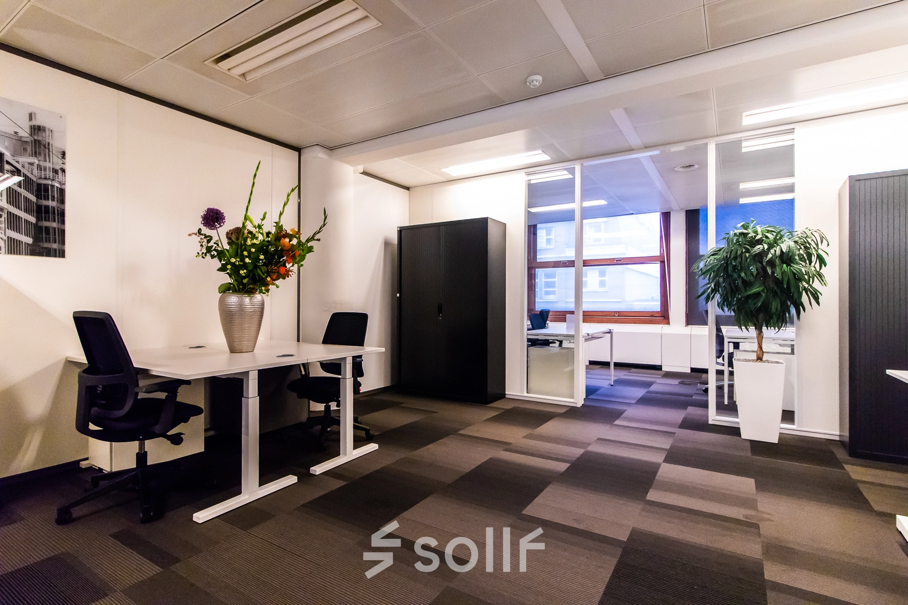 Office space at Paseo de Recoletos 5 in Madrid Recoletos features a modern furnished interior with desks and chairs, ideal for office space rental.