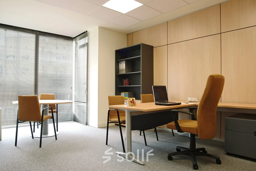 Bright office space on Avenida de Brasil 6, Madrid Tetuán, featuring desks, chairs, and shelves for rental use.