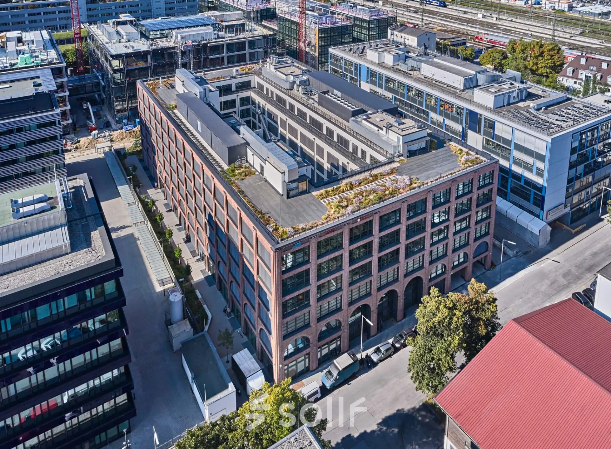Aerial view of the office building at Mühldorfstraße 8 in München Werksviertel, showcasing architecture suitable for office space rental.